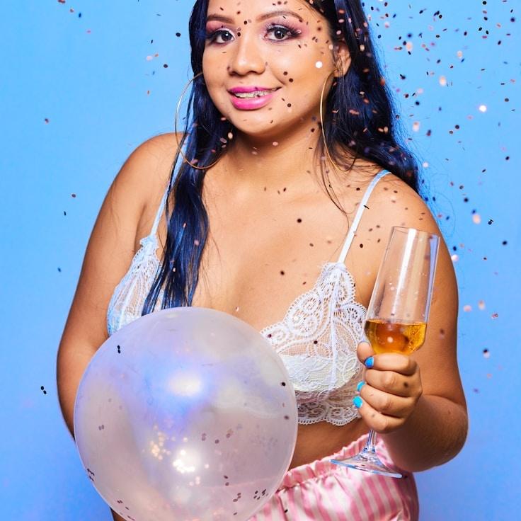 Anaya Rao, Lead Design Curator at LittlePineMurmur, reviewing corporate floral arrangements